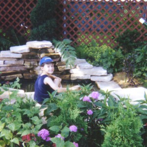 child next to pond
